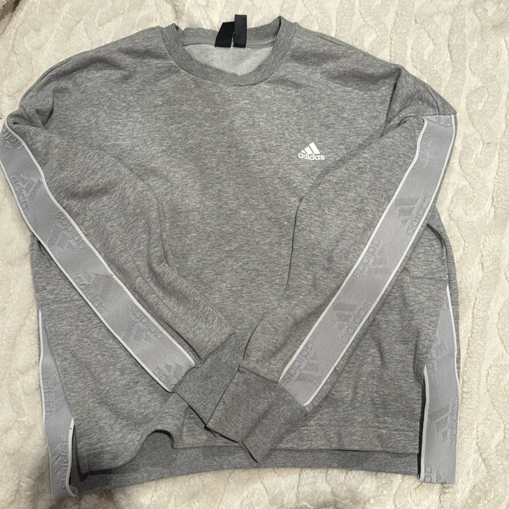 Grey adidas sweatshirt, two side slits